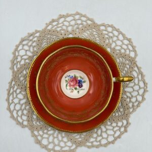 Aynsley Teacup and Saucer Flower Bouquet Center on Burnt Orange Colored Teacup