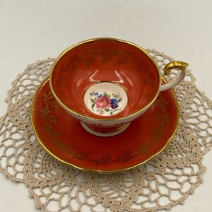 Aynsley Teacup and Saucer Flower Bouquet Center on Burnt Orange Colored Teacup